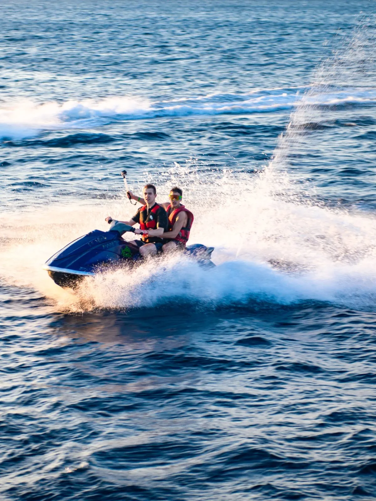 a group of people riding skis on a body of water